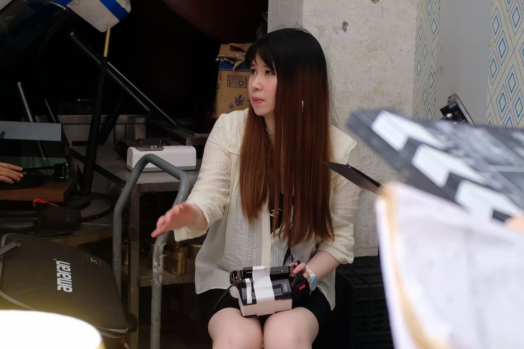 Katherine Ruihong Liu directing on set in Chongqing